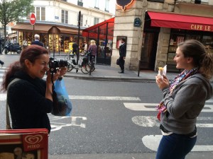 Diana taking a picture of Lisa with her crêpe 