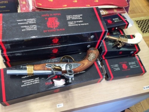 Um, would you like to buy a souvenir? Like a fake gun? It feels and looks very real, but try it out if you like.... er...