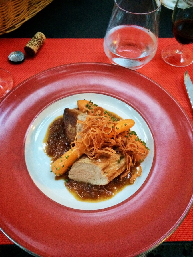 Pork tenderloin with honey and onion sauce, fried onions and garden carrots.