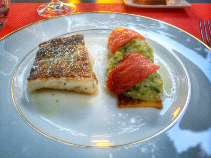 Broiled cod with crispy polenta, zucchini tartar and roasted tomatoes